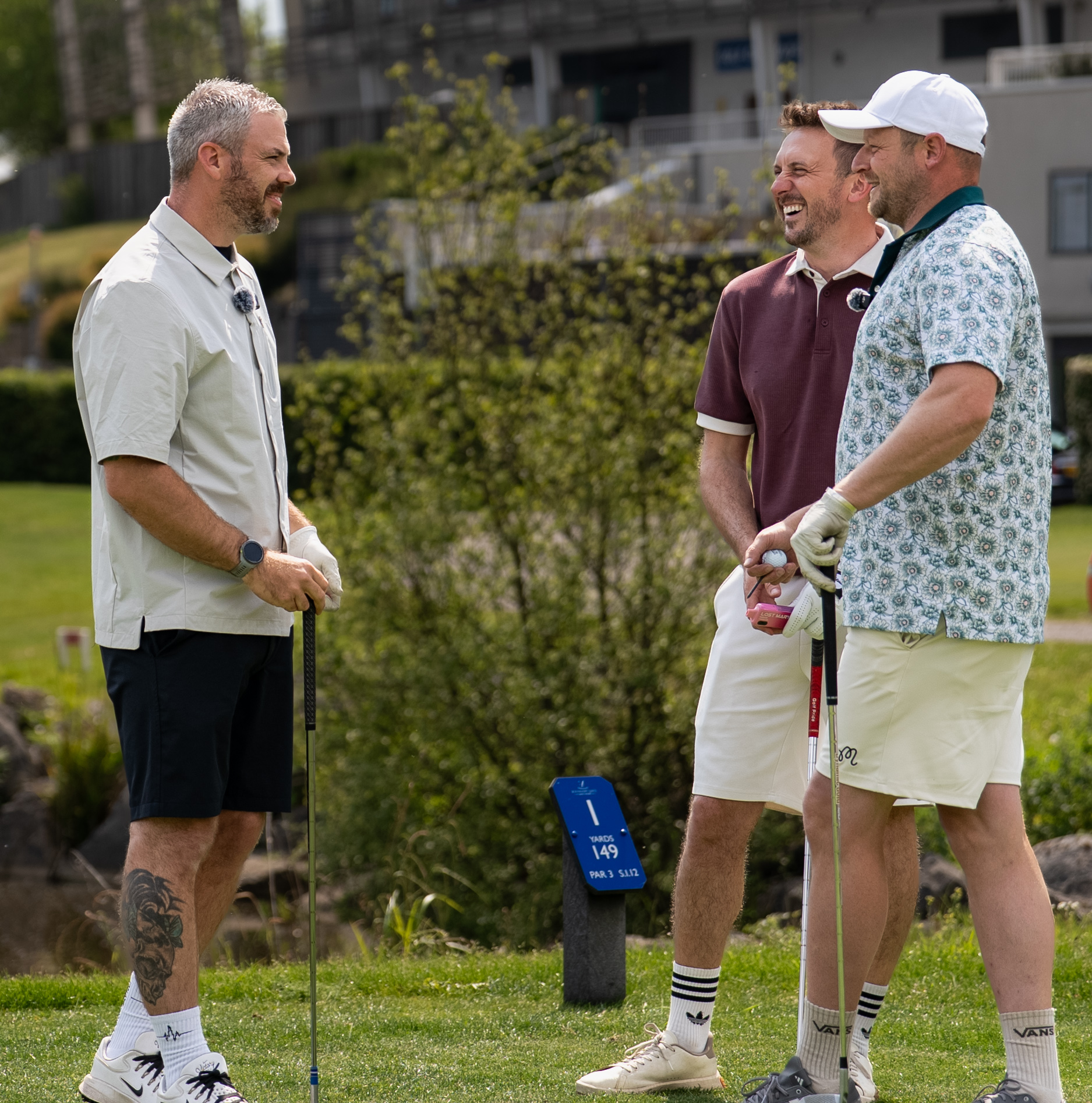 Golfers laughing together on the course